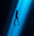 Mergulhador iluminado por raio de luz no escuro  Foto: Alex St-Jean / BBC News Brasil