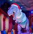 O uso de ícones pré  Foto: históricos como o T-Rex, durante as celebrações de Natal serve para reavivar o interesse pelas maravilhas da pré-história -  Museu de História Natural / Perfil Brasil
