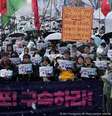 Protesto anti-Yoon tinha faixas com os dizeres "Prendam Yoon Suk Yeol"  Foto: DW / Deutsche Welle