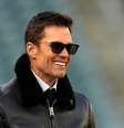 Ex-jogador de futebol americano Tom Brady sorri  Foto: Mitchell Leff  / Getty Images