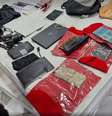 Objetos apreendidos na casa da "mainha do crime"  Foto: Divulgação SSP / Estadão