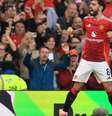  Foto: Carl Recine/Getty Images - Legenda: Bruno Fernandes celebra o belo gol de falta que marcou para o United no 1 a 1 com o Arsenal / Jogada10