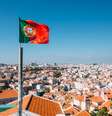 Imagem de Lisboa com bandeira de Portugal a frente  Foto: Getty Images / BBC News Brasil