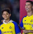 Yasser Bakhsh/Getty Images - Legenda: Cristiano Ronaldo ao lado do filho Júnior  Foto: Jogada10