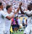  Foto: Richard Pelham/Getty Images - Legenda: Jogadores do Real Madrid comemoram o gol marcado por Arda Güler / Jogada10