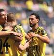  Foto: Michael Reaves/Getty Images - Legenda: Jogadores do Borussia Dortmund comemoram o gol marcado por Svensson / Jogada10