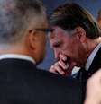 Bolsonaro olhando para baixo e com a mão na boca, durante depoimento no STF  Foto: Reuters / BBC News Brasil