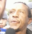 Suspeito de assassinato cospe no repórter da Band: 'Na minha cara'  Foto: Reprodução/ Band / Contigo