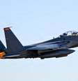 Um caça F-15E que participa da operação Fúria Épica no Oriente Médio, fotografado ao decolar em 16 de março de 2026.  Foto: © Reuters/Armée de l'air américaine / RFI