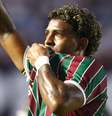 John Kennedy jogador do Fluminense comemora seu gol durante partida contra o Santos no estádio Vila Belmiro pelo campeonato Brasileiro A 2026.  Foto: MAURÍCIO DE SOUZA/AGIF - AGÊNCIA DE FOTOGRAFIA/ESTADÃO CONTEÚDO