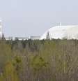 Local de contenção da usina de Chernobyl, onde um depósito de combustível nuclear foi atingido por um ataque russo, neste domingo, 7 de junho.  Foto: AFP - SERGEI SUPINSKY / RFI