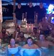 Willer Tomaz, ao centro, com punho erguido, ao lado de deputados e senadores em piscina de sua propriedade no entorno de Brasília  Foto: Reprodução/revista piauí / Estadão