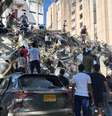 Moradores vasculham os escombros de um prédio que desabou após um terremoto, em Cali, na Colômbia - 10 de agosto de 2026  Foto: Reuters/Juan Pablo Arbelaez