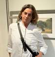 A fotógrafa Renata Siqueira Bueno na abertura de sua exposição em SP  Foto: Sala de TV