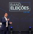 Flávio Bolsonaro e Lula se enfrentam em debate na noite deste domingo, 18  Foto: Reprodução/TV Band