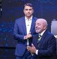 Lula e Flávio Bolsonaro durante debate da Band  Foto: BRUNO MOTTA/ENQUADRAR / Estadão
