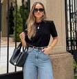 Calça jeans tendência para Primavera 2026: corte barrel é aposta entre as fashionistas. Foto: Reprodução/Instagram, @bytatysboutiquehn / Purepeople