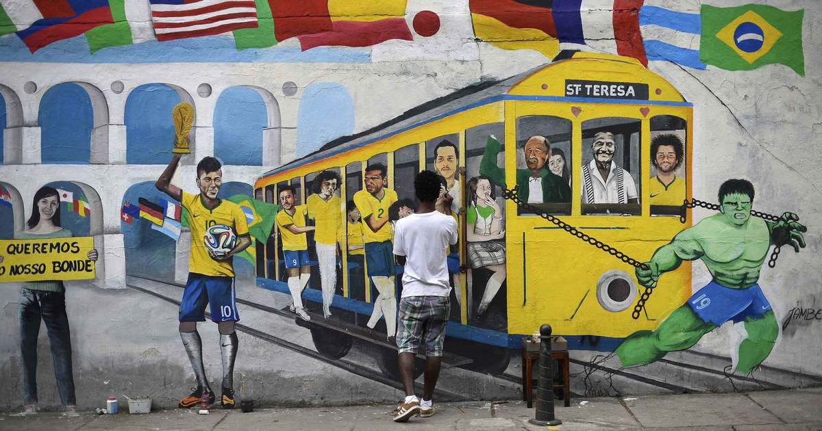 Muros espalhados pelo mundo recebem grafites em homenagem à Copa