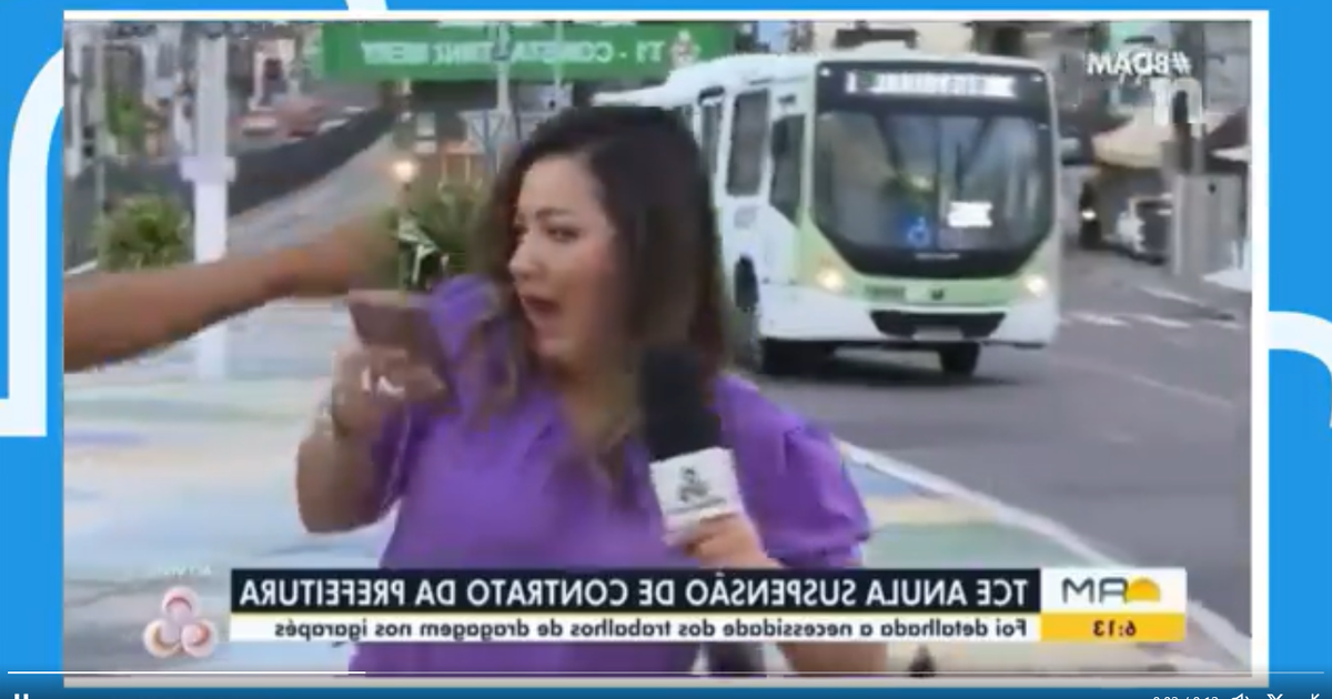 A Globo reporter is punched during a live broadcast