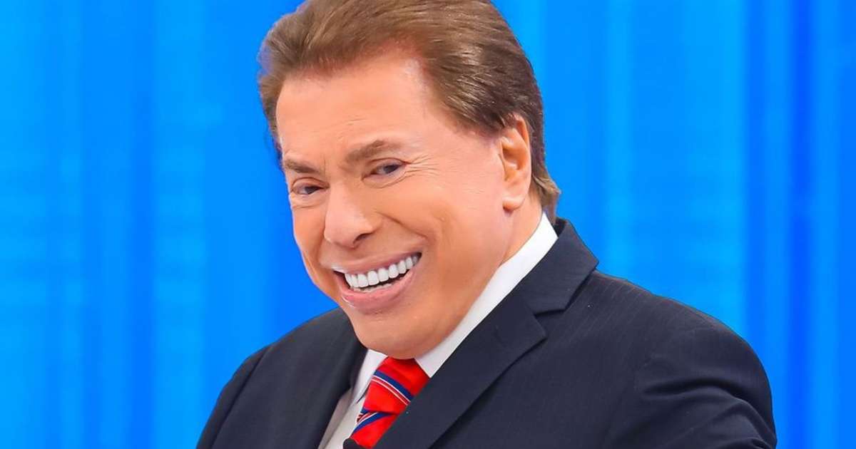 Silvio Santos jogando dinheiro para a plateia, contraste com a estratégia de reduflação