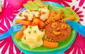 A criança pode usar talheres coloridos e pratos divertidos para ter mais prazer em comer