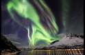 As imagens serão exibidas ao público no mesmo local, entre os dias 18 de setembro até fevereiro de 2015. Esta fotografia retrata a dança celestial da aurora boreal sobre um fiorde em Skjervøy, Troms, Noruega