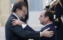 O primeiro ministro espanhol, Mariano Rajoy, é recebido pelo presidente francês antes do início das manifestações