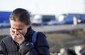 Dia 24/2 - Mulher chora durante travessia da fronteira entre Ucrânia e Polônia