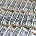 Dólar cai com realização de lucros e fecha em R$ 3,45