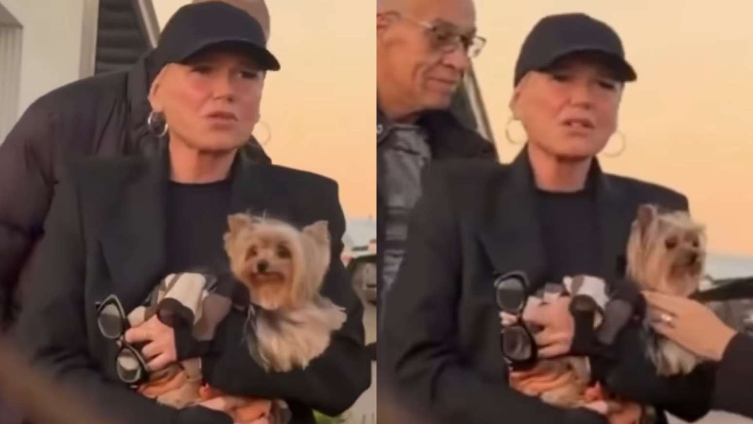 Xuxa segura a cadelinha Doralice durante desembarque em aeroporto