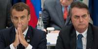 Macron disse que Bolsonaro mentiu ao dizer que atuaria contra o desmatamento, em encontro do G20 em junho, onde sentaram lado a lado  Foto: AFP / BBC News Brasil