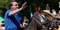 Bolsonaro andou a cavalo em manifesta&ccedil;&atilde;o a seu favor em Bras&iacute;lia Foto: Reuters / BBC News Brasil
