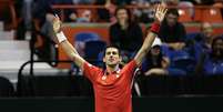 <p>Djokovic fez dois pontos na vit&oacute;ria da S&eacute;rvia por 3 a 1</p>  Foto: AP