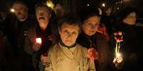 Na capital Kiev, autoridades e parentes das vítimas também fizeram uma cerimônia perante um memorial  Foto: AP