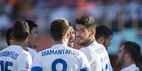 Jogadores da Grécia comemoram gol na vitória sobre o México  Foto: AP