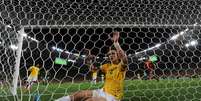 <p>David Luiz quebrou nariz no começo da Copa e foi herói na final contra Espanha</p>  Foto: AFP