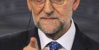 O primeiro-ministro espanhol, Mariano Rajoy, garante que não pretende deixar o cargo  Foto: AP