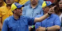 <p>Capriles pede mudanças em protesto em Caracas </p>  Foto: AP