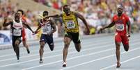<p>Bolt disparou na última parcial da Jamaica e garantiu o ouro</p>  Foto: AP