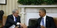 O premiê israelense, Benjamin Netanyahu, durante conversa com Barack Obama na Casa Branca  Foto: AP