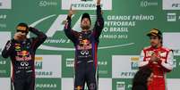 Vettel comemora mais uma vitória na temporada, a 13ª. Pódio ainda teve o companheiro Mark Webber e o rival Fernando Alonso  Foto: Reuters