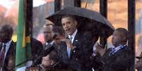 Obama discursa durante cerimônia oficial de despedida a Mandela  Foto: AFP
