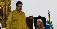 Maduro presta homenagem a Mandela durante missa em Caracas  Foto: AFP