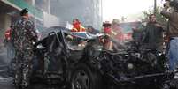 Carro virou um monte de ferro retorcido depois da grande explosão  Foto: AFP