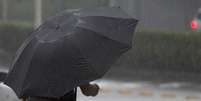 Paulistano enfrentou chuva na tarde desta sexta-feira  Foto: Marcelo Pereira / Terra