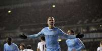 Dzeko comemora terceiro gol do City em Londres  Foto: AP