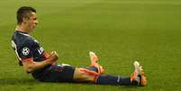 Brasileiro Marquinhos comemora gol na partida que garantiu a classificação do PSG às quartas de final da Liga dos Campeões  Foto: AFP
