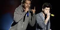 A boy band One Direction se apresentou neste sábado (10) sob forte chuva para um público de 60 mil fãs no Estádio do Morumbi, em São Paulo  Foto: Ricardo Matsukawa / Terra