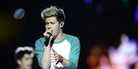 A boy band One Direction se apresentou neste sábado (10) sob forte chuva para um público de 60 mil fãs no Estádio do Morumbi, em São Paulo  Foto: Ricardo Matsukawa / Terra
