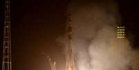 <p>Foguete decolou à noite do cosmódromo de Baikonur, no Cazaquistão</p>  Foto: AFP